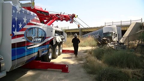 Semi goes over side of bridge on Golden State Highway, into canal