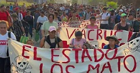 Migrants march through Mexico demanding justice over detention centre deaths - BBC News