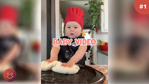 Video of baby making pizza