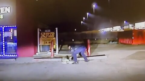 Police officer removes jar from raccoon's head