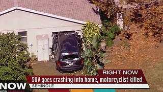 Crash involving vehicle, motorcycle and home in Seminole