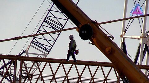 Brave Human walks on Giant Crane at SpaceX Rocket Factory