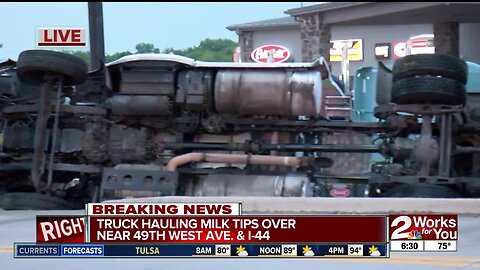 Truck hauling milk tips over in Southwest Tulsa