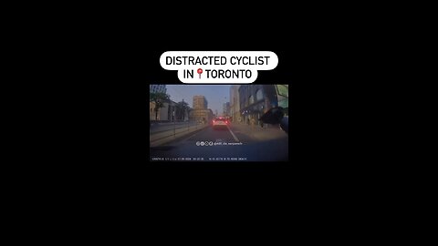 Distracted Cyclist In Downtown Toronto