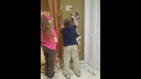 Boy Tries To Remove A Hammer Stuck In The Wall