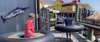 Bumper tables help people social distance at a bar