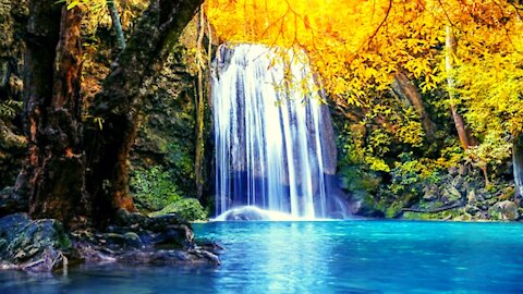 Incredible waterfall with blue waters amidst nature in a calm and peaceful environment.