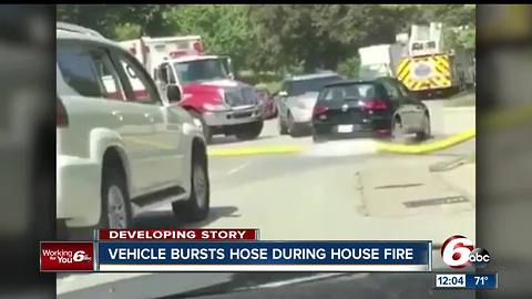 Indianapolis Fire Department wants to know who ran over one of their hoses at a fire scene