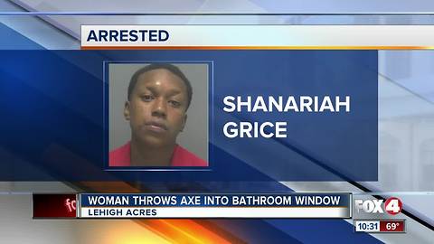 Woman Throws Axe into Bathroom Window