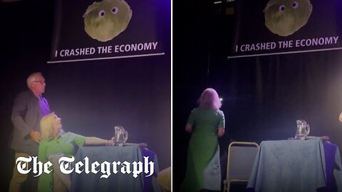 Liz Truss storms off stage after lettuce banner stunt