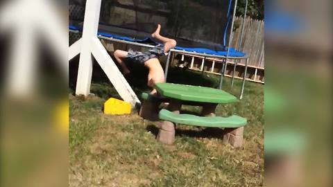 "Boy Slips and Does Front Flip Under Trampoline"