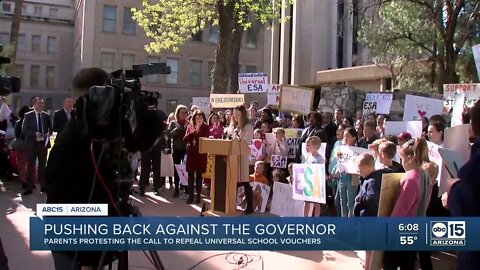 Parents protesting the call to repeal universal school vouchers