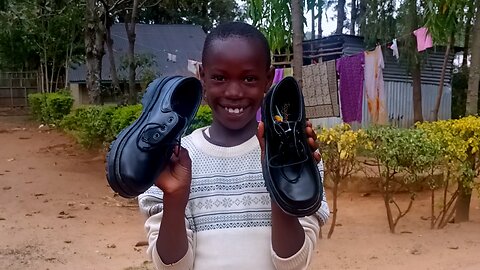 African farmer and her son upload videos to pay for his education