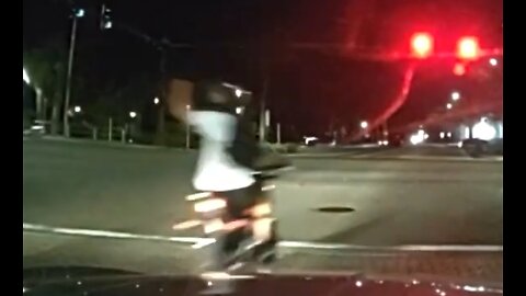 Motorcyclist Gives Cops The Finger Before Getting Hit By A Truck