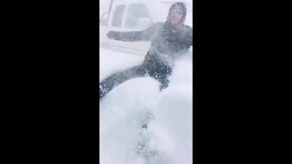 Watch this guy demonstrate how intense the Newfoundland blizzard is