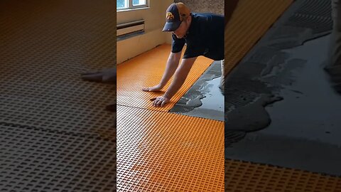 Laying uncoupling membrane! #tiling #tilework #construction #flooring