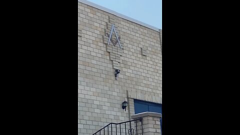 Free-masonic ritual building with no windows and barbecues lying outside.