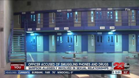 Officer accused of smuggling phones and drugs