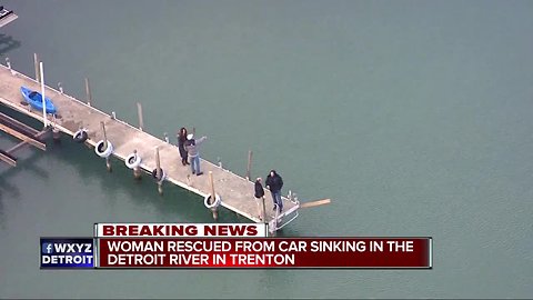 Police officer in kayak rescues woman from sinking car in Detroit River