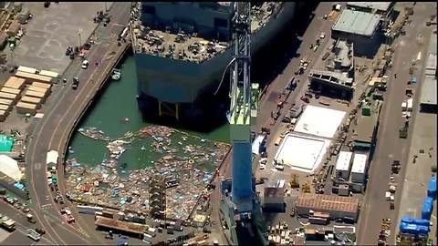 Barrier collapses, flooding San Diego dry dock