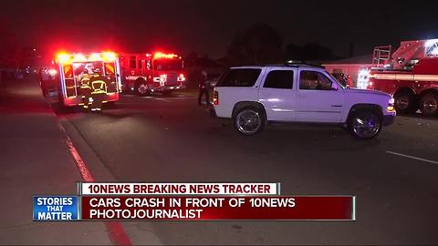 Car crashes in front of 10News photojournalist