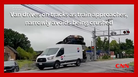 Van drives on tracks as train approaches, narrowly avoids being crushed