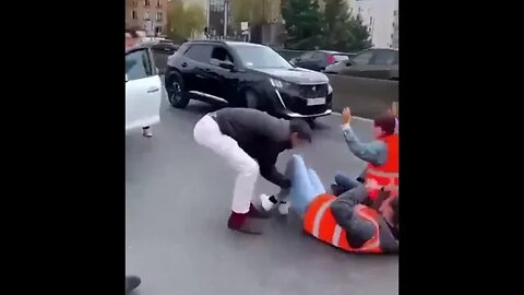 Angry French man gives climate protesters help getting out of the road