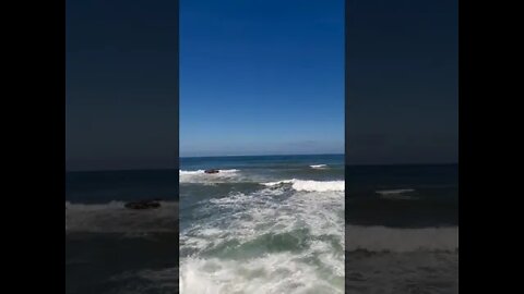 Foamy Sea Waves Rolling to the Sea Shore