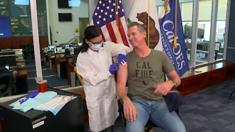 Governor Gavin Newsom gets flu shot during press briefing