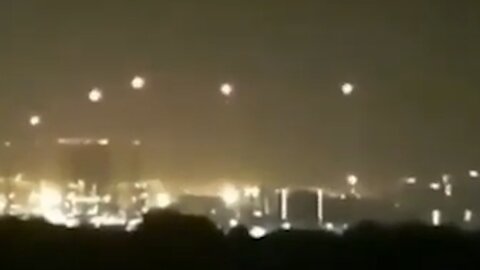 Four UFOs sending small UFOs into the city at night [Space]