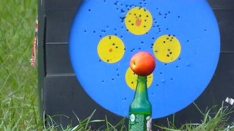 Shooting an apple with a bow and arrow