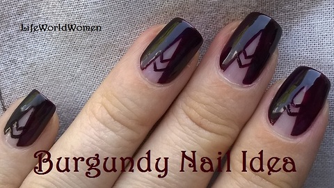 Burgundy negative space tale nail art