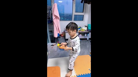 Cute kid's funny style of breaking egg breaking