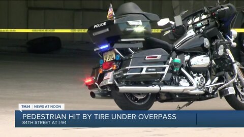 Wheel flies off van, hits pedestrian under I-94 overpass, police say