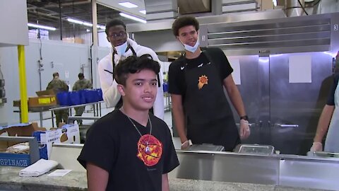 Phoenix Suns players trade jerseys for aprons to help families in need