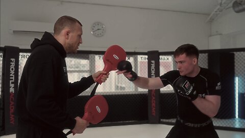 MMA fighter Benjamin Hauser doing padwork with Jack Hermansson