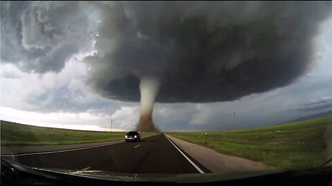 Storm chasing dashcam: Tornado crossing the highway! Laramie, Wyoming