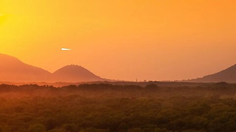 Triangle Shaped UFO Seen Over Mountains