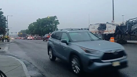 contractors milling down the asphalt on Mass Ave