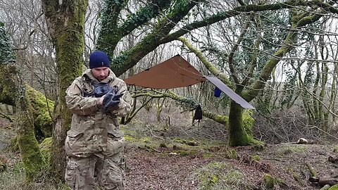 Let's start taking down the DD hammocks 3x3 tarp. Reddacleave campsite. Dartmoor 26th March 2023