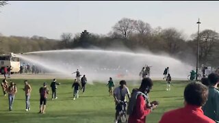 COVID NIGHTMARE: Belgian Police Use WATER CANNONS to Stop People from Gathering in Park