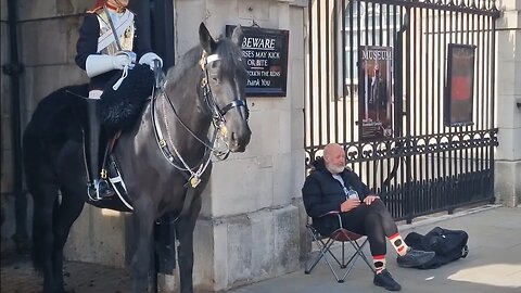 He brings a chair and a bottel of whisky just the start of a weird day at horse guards