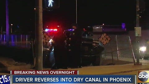 Driver reverses into dry canal in Phoenix