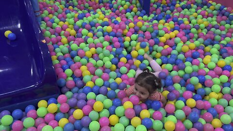 Baby having fun at playland