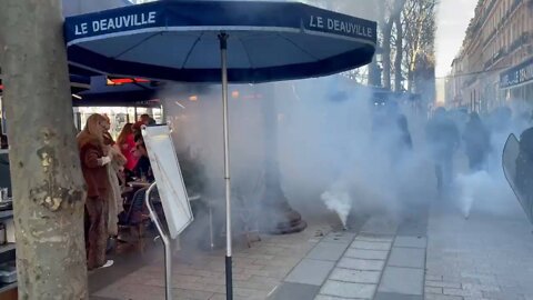 PARIS: Police deploy tear gas against freedom convoy on the Champs-Élysée.