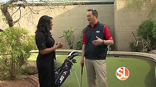 Susan Casper gets golf tips from a pro