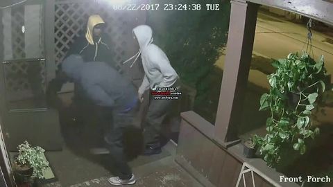 Video: Armed men try to kick in door of Lansing home