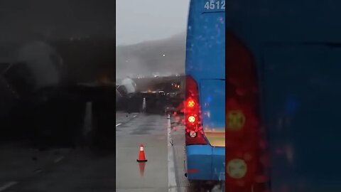 Truck tumbles over side of CA freeway.