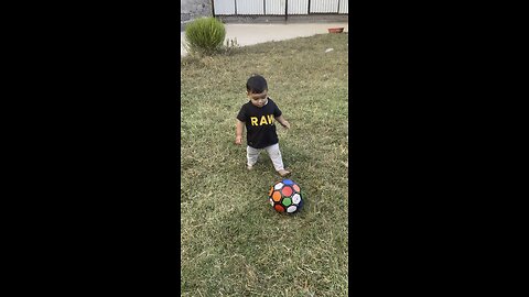 Playing football child