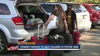 Local woman collecting suitcase donations